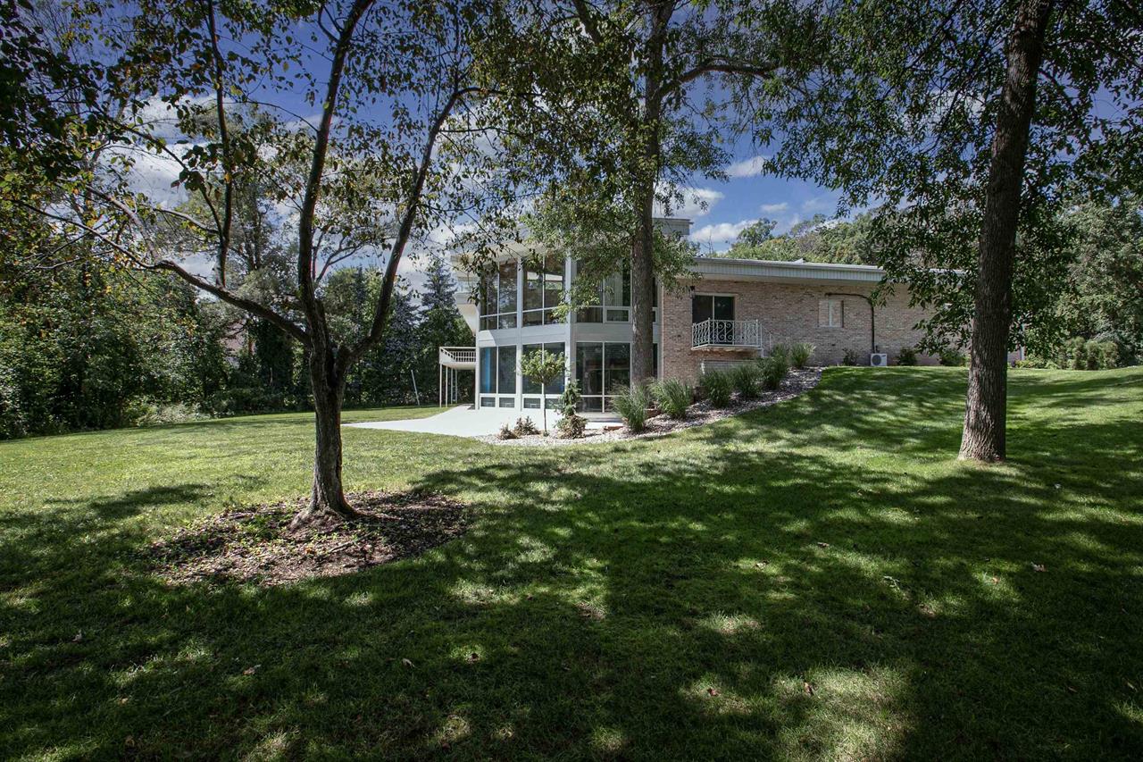 Front yard of a riverside mansion in the Fox Cities